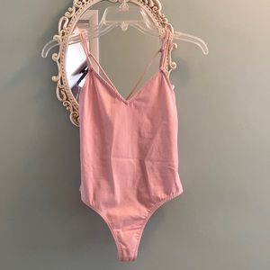 New without tags pink body suit